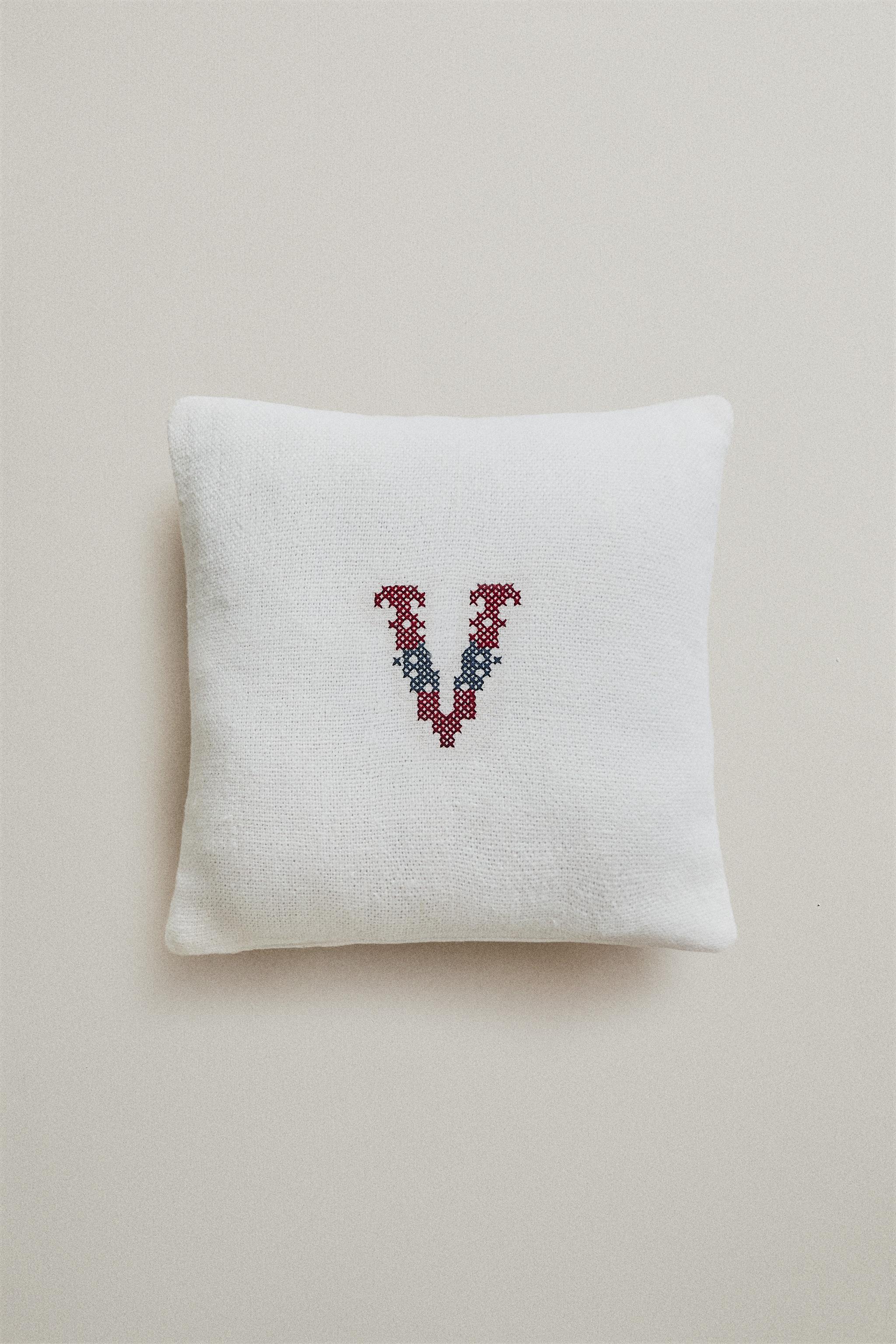 EMBROIDERED 'V' LETTER LINEN CUSHION